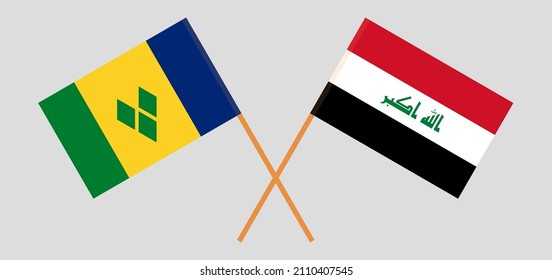 Crossed flags of Saint Vincent and the Grenadines and Iraq. Official colors. Correct proportion. Vector illustration
