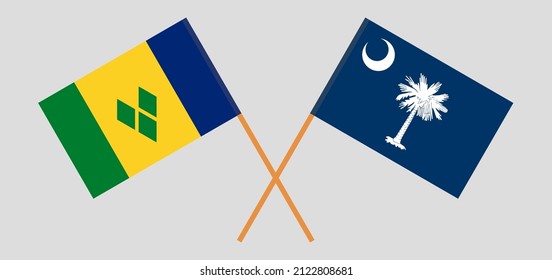 Crossed flags of Saint Vincent and the Grenadines and The State of South Carolina. Official colors. Correct proportion. Vector illustration

