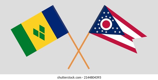 Crossed flags of Saint Vincent and the Grenadines and the State of Ohio. Official colors. Correct proportion. Vector illustration
