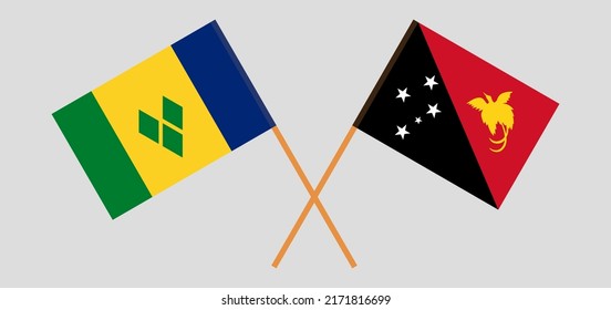 Crossed flags of Saint Vincent and the Grenadines and Papua New Guinea. Official colors. Correct proportion. Vector illustration
