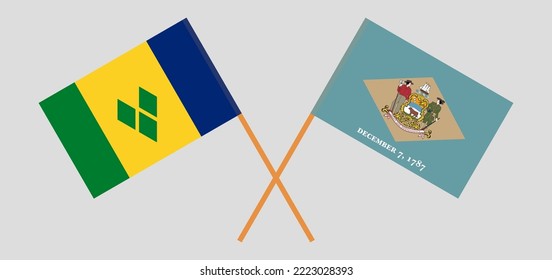 Crossed flags of Saint Vincent and the Grenadines and The State of Delaware. Official colors. Correct proportion. Vector illustration
