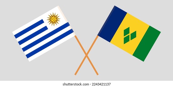 Überquerte Flaggen von St. Vincent und die Grenadinen und Uruguay. Offizielle Farben. Richtiger Anteil. Vektorgrafik
