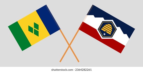 Crossed flags of Saint Vincent and the Grenadines and The State of Utah. Official colors. Correct proportion. Vector illustration
