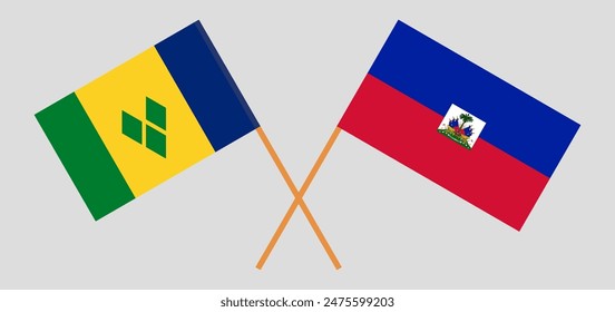 Crossed flags of Saint Vincent and the Grenadines and Haiti. Official colors. Correct proportion. Vector illustration
