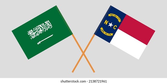 Crossed flags of Saudi Arabia and The State of North Carolina. Official colors. Correct proportion. Vector illustration
