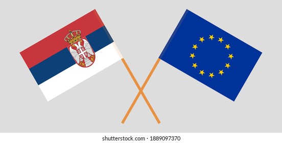 Crossed flags of Serbia and the EU