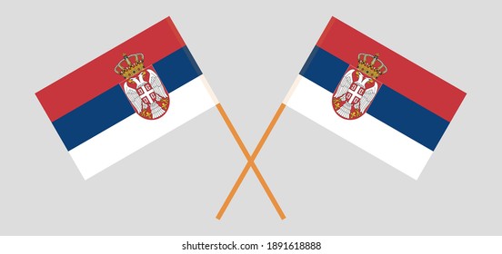 Crossed flags of Serbia. Official colors. Correct proportion. Vector illustration
