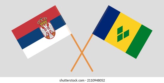 Crossed flags of Serbia and Saint Vincent and the Grenadines. Official colors. Correct proportion. Vector illustration
