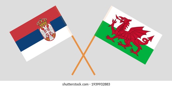 Crossed flags of Serbia and Wales. Official colors. Correct proportion