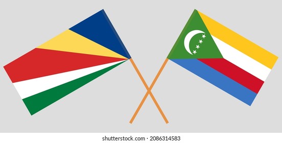 Crossed flags of Seychelles and the Comoros. Official colors. Correct proportion. Vector illustration
