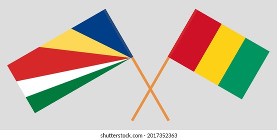 Crossed flags of Seychelles and Guinea. Official colors. Correct proportion
