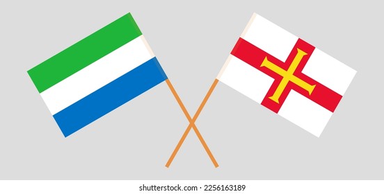 Crossed flags of Sierra Leone and Bailiwick of Guernsey. Official colors. Correct proportion. Vector illustration
