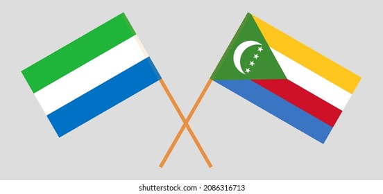 Crossed flags of Sierra Leone and the Comoros. Official colors. Correct proportion. Vector illustration
