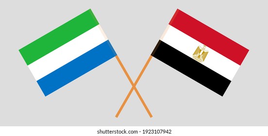 Crossed flags of Sierra Leone and Egypt. Official colors. Correct proportion