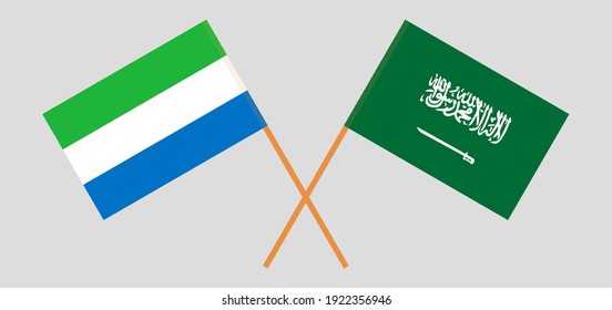 Crossed flags of Sierra Leone and the Kingdom of Saudi Arabia. Official colors. Correct proportion