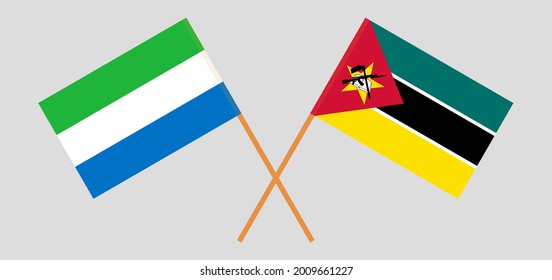 Crossed flags of Sierra Leone and Mozambique. Official colors. Correct proportion