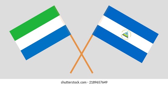 Crossed flags of Sierra Leone and Nicaragua. Official colors. Correct proportion. Vector illustration
