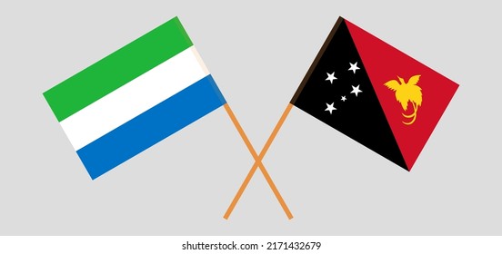 Crossed flags of Sierra Leone and Papua New Guinea. Official colors. Correct proportion. Vector illustration
