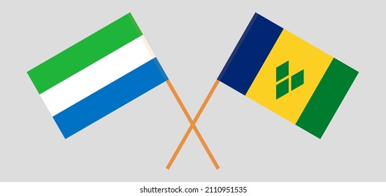 Crossed flags of Sierra Leone and Saint Vincent and the Grenadines. Official colors. Correct proportion. Vector illustration
