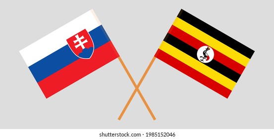 Crossed flags of Slovakia and Uganda. Official colors. Correct proportion