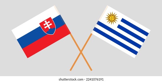 Crossed flags of Slovakia and Uruguay. Official colors. Correct proportion. Vector illustration
