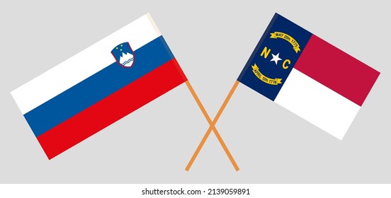 Crossed flags of Slovenia and The State of North Carolina. Official colors. Correct proportion. Vector illustration
