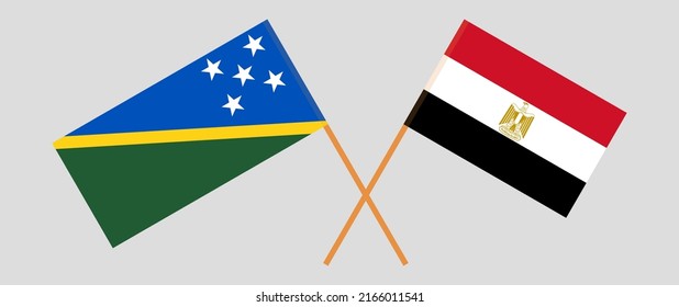 Crossed flags of Solomon Islands and Egypt. Official colors. Correct proportion. Vector illustration
