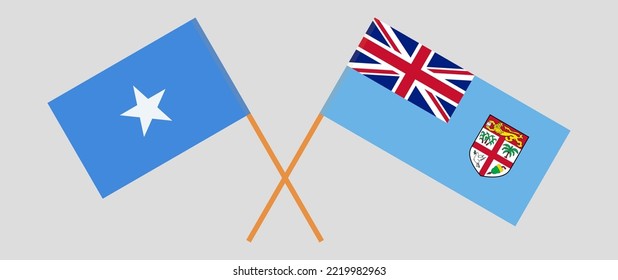 Crossed flags of Somalia and Fiji. Official colors. Correct proportion. Vector illustration
