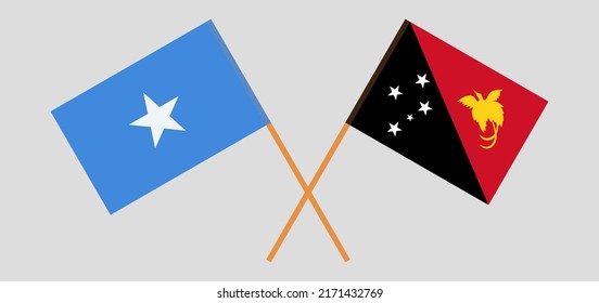Crossed flags of Somalia and Papua New Guinea. Official colors. Correct proportion. Vector illustration
