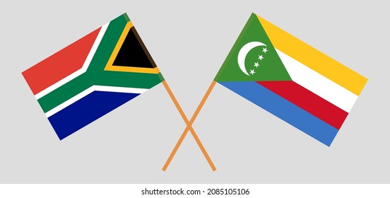 Crossed flags of South Africa and the Comoros. Official colors. Correct proportion. Vector illustration
