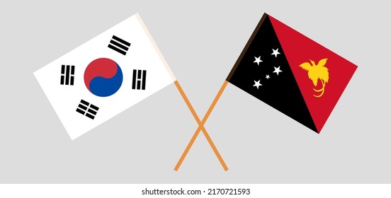Crossed flags of South Korea and Papua New Guinea. Official colors. Correct proportion. Vector illustration
