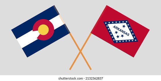 Crossed flags of The State of Colorado and The State of Arkansas. Official colors. Correct proportion. Vector illustration