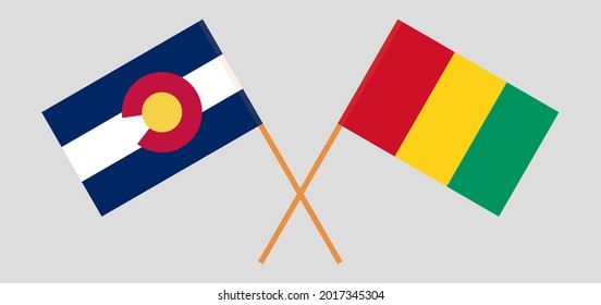 Crossed flags of The State of Colorado and Guinea. Official colors. Correct proportion
