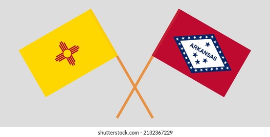 Crossed flags of the State of New Mexico and The State of Arkansas. Official colors. Correct proportion. Vector illustration
