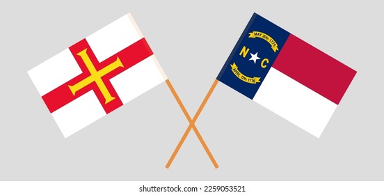 Crossed flags of The State of North Carolina and Bailiwick of Guernsey. Official colors. Correct proportion. Vector illustration
