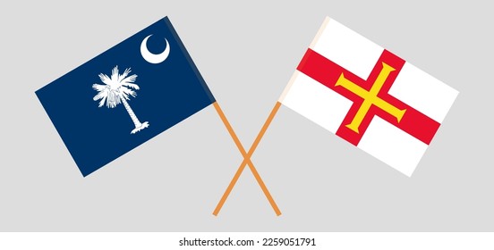 Crossed flags of The State of South Carolina and Bailiwick of Guernsey. Official colors. Correct proportion. Vector illustration
