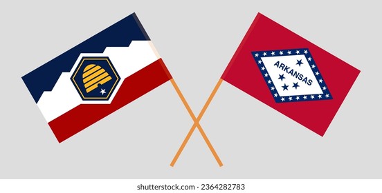 Crossed flags of The State of Utah and The State of Arkansas. Official colors. Correct proportion. Vector illustration
