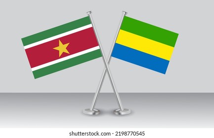 Crossed flags of Suriname and Gabon. Official colors. Correct proportion. Banner design