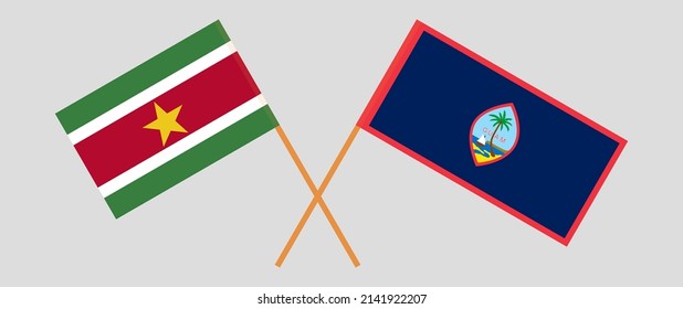 Crossed flags of Suriname and Guam. Official colors. Correct proportion. Vector illustration

