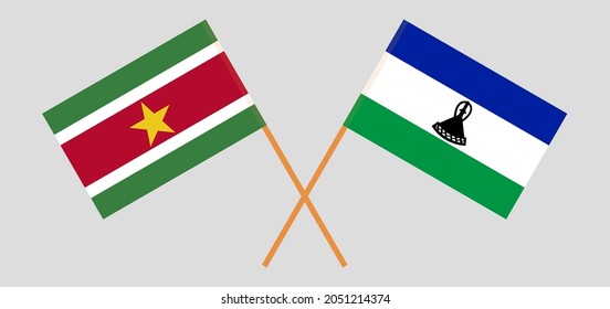 Crossed flags of Suriname and Kingdom of Lesotho. Official colors. Correct proportion