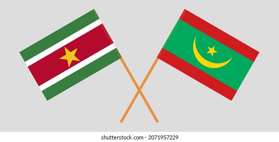 Crossed flags of Suriname and Mauritania. Official colors. Correct proportion