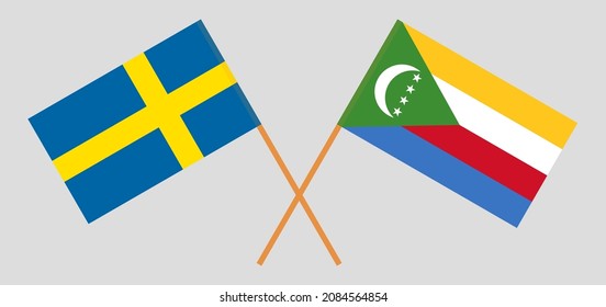 Crossed flags of Sweden and the Comoros. Official colors. Correct proportion. Vector illustration
