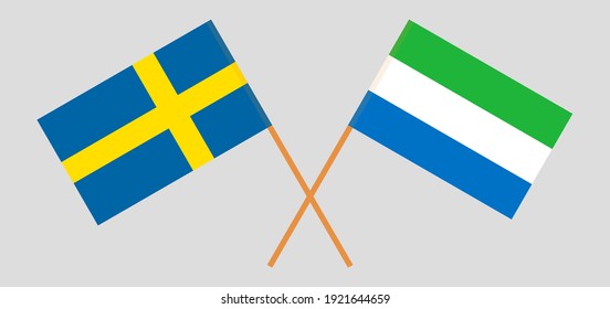Crossed flags of Sweden and Sierra Leone. Official colors. Correct proportion