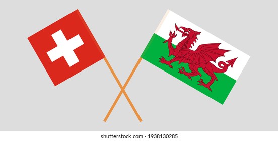 Crossed flags of Switzerland and Wales. Official colors. Correct proportion