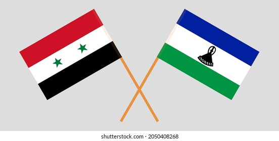 Crossed flags of Syria and the Kingdom of Lesotho. Official colors. Correct proportion