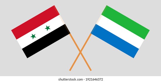 Gekreuzte Flaggen Syriens und Sierra Leones. Offizielle Farben. Richtiger Anteil