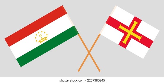 Crossed flags of Tajikistan and Bailiwick of Guernsey. Official colors. Correct proportion. Vector illustration
