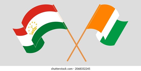 Crossed flags of Tajikistan and Republic of Ivory Coast. Official colors. Correct proportion