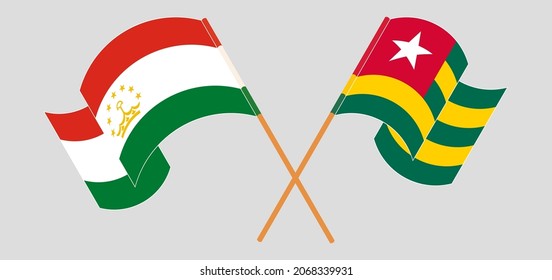 Crossed flags of Tajikistan and Togo. Official colors. Correct proportion