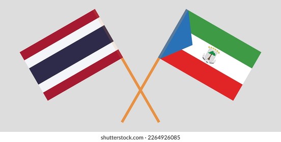 Crossed flags of Thailand and Equatorial Guinea. Official colors. Correct proportion. Vector illustration
